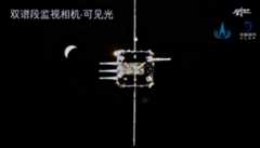 The approaching ascent vehicle and a crescent Earth viewed from the Chang'e 5 orbiter.