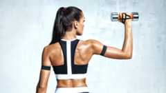 a photo of a woman with strong shoulders holding dumbbells