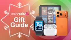 Apple Watch SE 3, AirPods Pro, iPhone 17 Pro Max, and Kindle Colorsoft on orange background with TechRadar gift guide text overlay