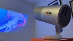 The Xgimi MoGo 4 portable projector close-up, with an image of a jellyfish in the background