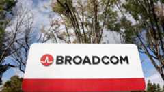 Broadcom sign with trees and the sky in the background