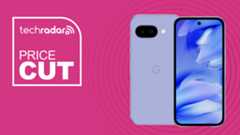 The Google Pixel 9a on a pink background. Text reads: Price Cut