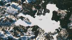 An astronaut photo of a perfectly white lake in Yellowstone National Park