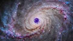 An illustration shows dark matter powering the heart of a spiral galaxy