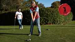 Two golfers teeing off wearing football shirts and jeans