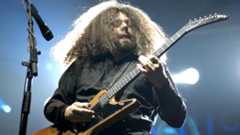 Claudio Sanchez performing onstage with Coheed And Cambria in 2005