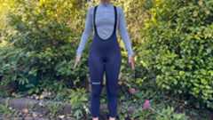 Universal Colours Mono Tights on navy blue on a white woman in a gray baselayer standing in front of greenary