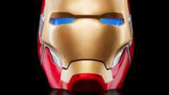 Iron Man Marvel Legends Helmet with glowing blue eyes against a dark background