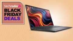 A Dell 15 against an orange TechRadar Black Friday deals background