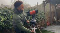 Author operating the telescope in the back yard