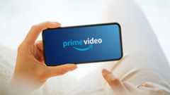 Amazon Prime Video logo on a phone being held by someone