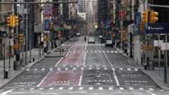 Broadway in new york wiht no cars and one person in the road