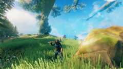 Valheim - a player stands in a grassy field hefting a pickaxe
