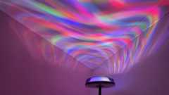 The Govee Uplighter Floor Lamp is in a corner, projecting an aurora borealis effect onto the ceiling.