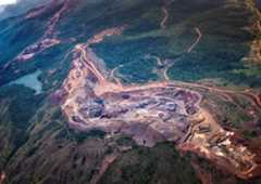 aerial view of an industrial area surrounded by rainforest