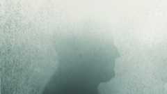 an illustration of a man's silouette, with the top half of the head fading as if into a fog