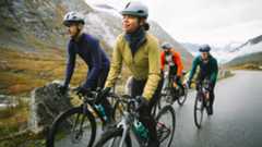 Four ridres climbing a mountain road on bikes