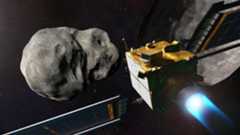 A spacecraft with solar panels heads for an asteroid in the darkness of space