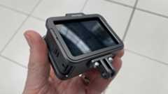 Image of the back of an Akaso Brave 8 Lite action camera in someone's hand