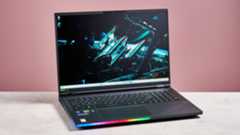 Acer Predator Helios 18 AI open on desk with pink background