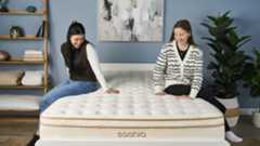 Tom's Guide Sleep Testers Eve Davies and Frances Daniels sit on the Saatva Classic luxury innerspring hybrid mattress in our Sleep Product Testing Lab while our Managing Editor of Sleep Claire Davies asks them what they think of the mattress in terms of support and comfort