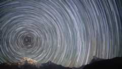 A series of lights in concentric circles show the rotation of the night sky as Earth spins on its axis