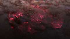 Clouds of pink and red swirl like smoke amidst the darkness of space