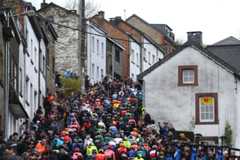 LIEGE BELGIUM APRIL 24 A general view of the peloton climbing to the Cte de SaintRoch 456m while fans cheer during the 110th Liege Bastogne Liege 2024 Mens Elite a 2545km one day race from Liege to UCIWT on April 24 2024 in Liege Belgium Photo by Dario BelingheriGetty Images
