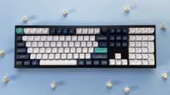 The Keychron Q6 Max mechanical keyboard against a blue background.