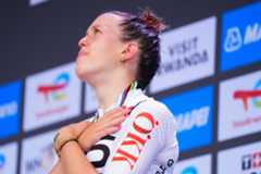 Picture by Zac Williams/SWpix.com - 27/09/2025 - Cycling - 2025 UCI Road World Championships - Kigali Convention Centre, Kigali, Rwanda - Women Junior Road Race Podium - Anja Grossmann (Switzerland) looks up to the sky after receiving the Bronze Medal in memory of teammate and friend Muriel Furrer who passed away during the Women Junior Road Race World Championship last year