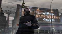 The protagonist of GTA 4 holding his hand out in front of a Diner