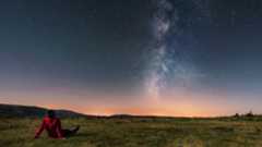 Man under night sky with milky way