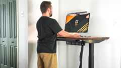 A person working at one of the best standing desks