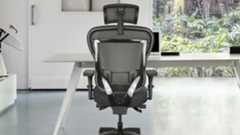 The Oak Hollow Aloria office chair seen from behind pushed into a desk