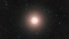 This image of Betelgeuse is a color composite made from exposures from the Digitized Sky Survey 2 (DSS2). A bright ball of light glows in the middle of deep space