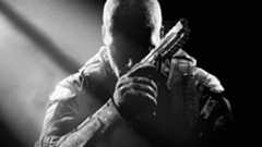 Key art for Call of Duty Black Ops 2 showing a character sitting in darkness with a handgun, from Edge 353