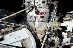 Russian cosmonauts Sergey Prokopyev (at right) and Dmitry Petelin work along a Strela boom during a Nov. 17, 2022 spacewalk outside of the Russian segment of the International Space Station.