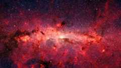 a red field of bright gas on a starry background