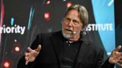 Jim Keller giving a talk at a show.