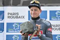 First placed Alpecin-Deceuninck's Dutch rider Mathieu van der Poel celebrates with his award on the podium of the 122nd edition of the Paris-Roubaix one-day classic cycling race, 259,2 km between Compiegne and Roubaix, northern France on April 13, 2025. (Photo by Jeff PACHOUD / AFP) (Photo by JEFF PACHOUD/AFP via Getty Images)