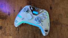 The Flydigi Apex 5 with its screen and lighting on