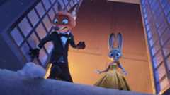 Nick and Judy standing on a snowy window ledge and looking down in Zootopia 2