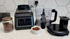 The Ninja 3-in-1 Food Processor with Auto-IQ BN800UK with hazelnurts waiting to be chopped in the appliance