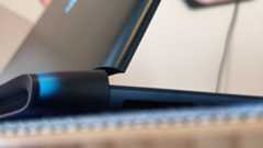 An Alienware 16 Area-51 laptop on a wooden desk