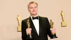 Christopher Nolan with his Oscars for Oppenheimer
