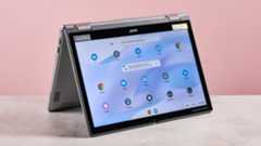 Acer Chromebook Spin 312 open upside down on desk with pink background