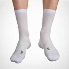 Male cyclist wearing the Assos Essence High cycling socks