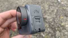 Image of the side port cover of an Akaso Brave 8 Lite action camera in someone's hand