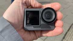 Image of the front of an Akaso Brave 8 Lite action camera in someone's hand