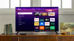 Roku TV on stand in living room